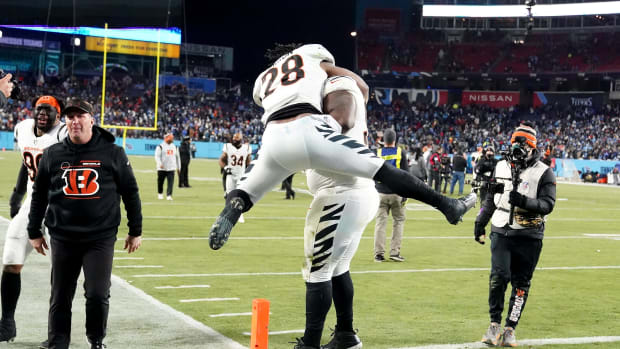 Cincinnati Bengals nose tackle D.J. Reader (98) and Cincinnati Bengals running back Joe Mixon (28) embrace in celebration after the victory in an NFL divisional playoff football game against the Tennessee Titans, Saturday, Jan. 22, 2022, at Nissan Stadium in Nashville. The Cincinnati Bengals defeated the Tennessee Titans, 19-16, to advance to the AFC Championship game. Cincinnati Bengals At Tennessee Titans Jan 22 Afc Divisional Playoffs